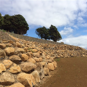 Volcanic paddock stone rock retaining wall at Onekainga Heights Whananaki