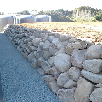 Volcanic paddock stone rock retaining wall